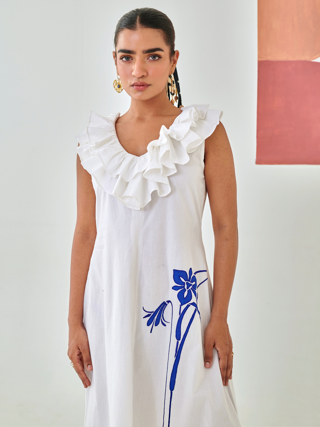 White A line dress with ruffled neckline & embroidery detail